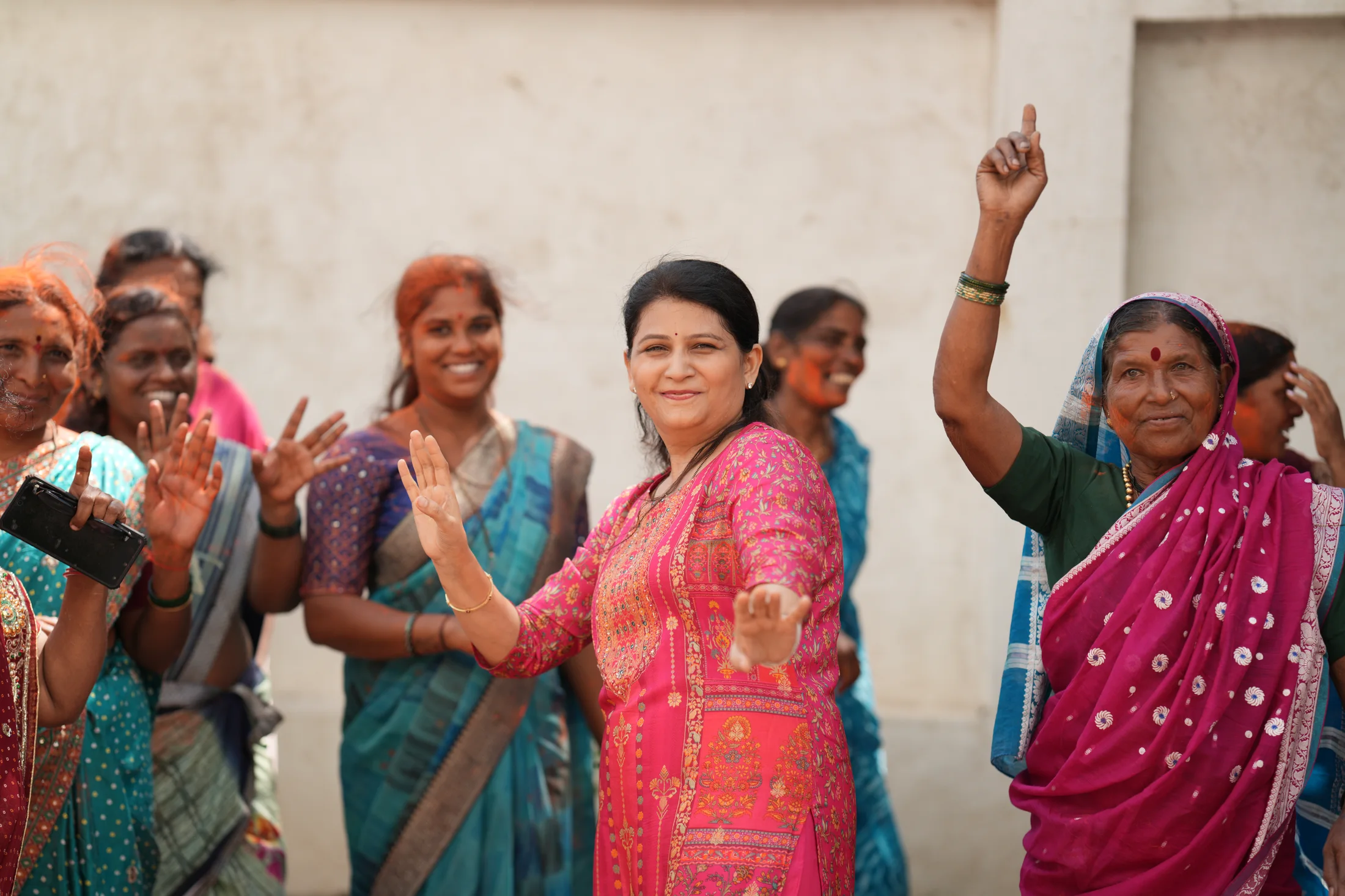 Community members smiling and dancing during Ganesha Week