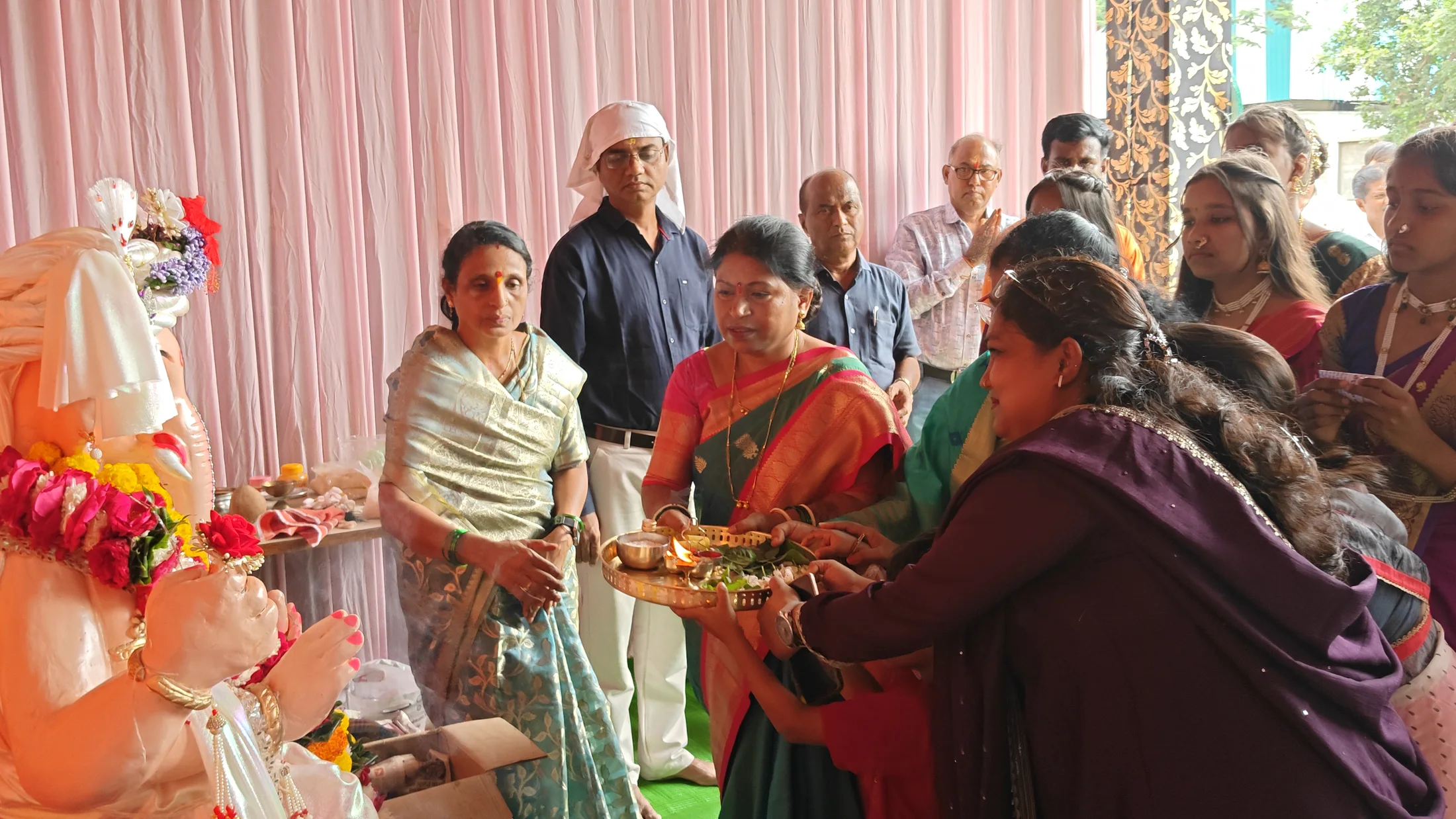 School community gathered near the Ganpati altar