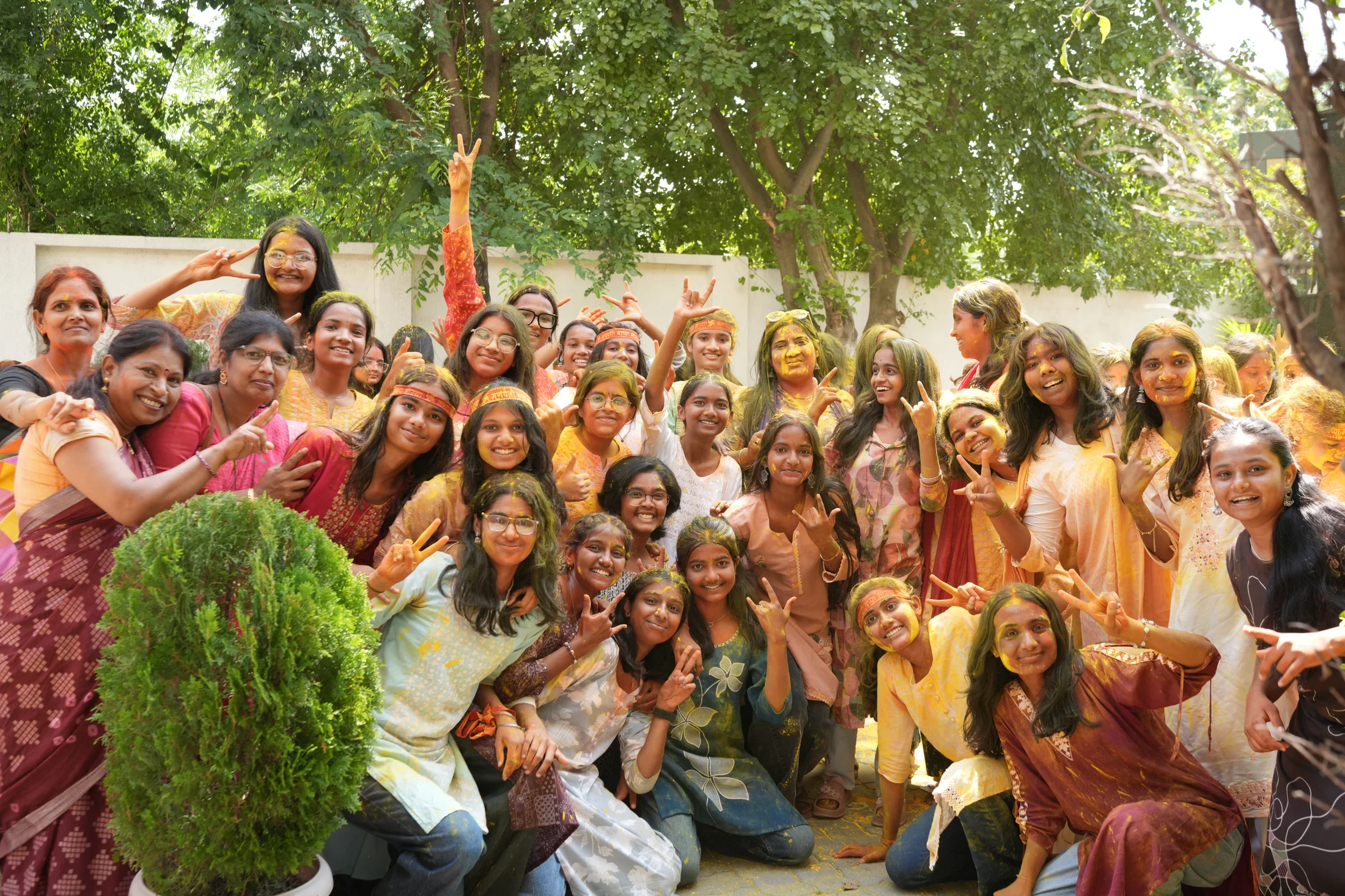 Large student group smiling together after Ganpati celebration