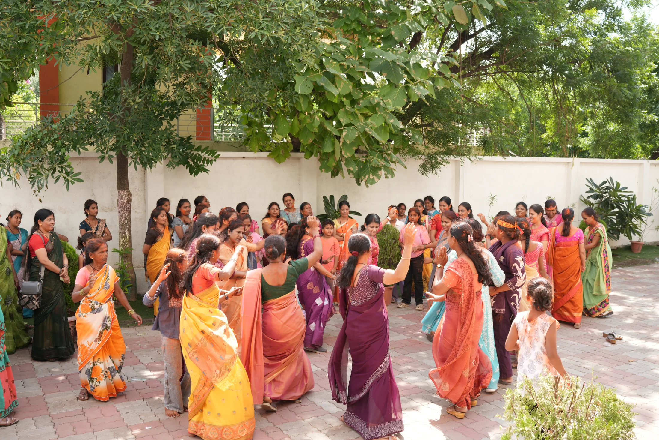 Women celebrating together during the campus procession
