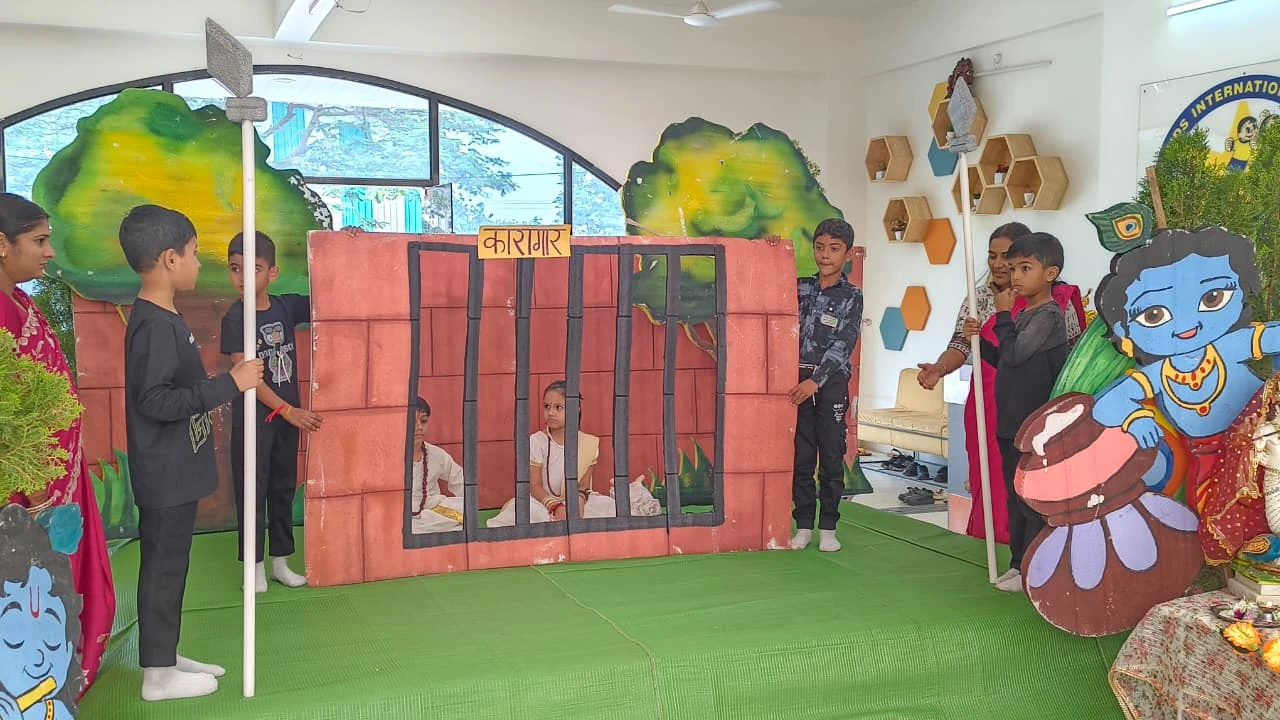 Students enacting the Krishna-birth कारागार enactment on stage