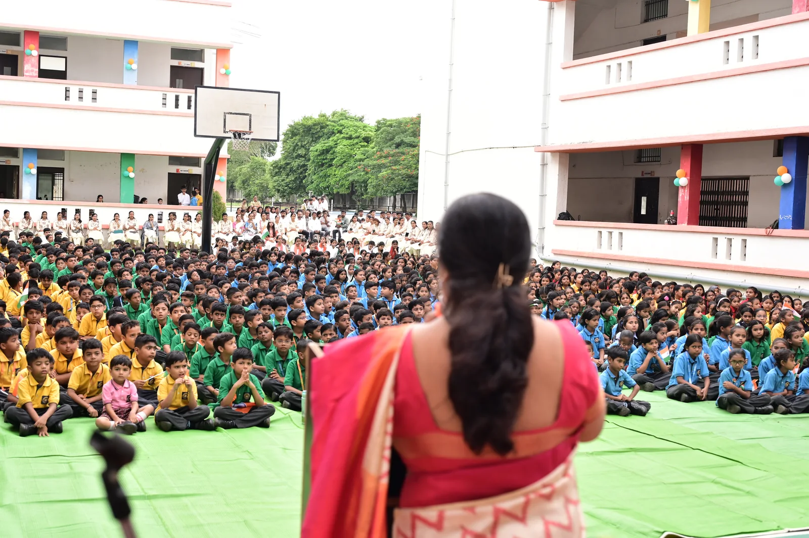 Hundreds of attentive students listening across the campus