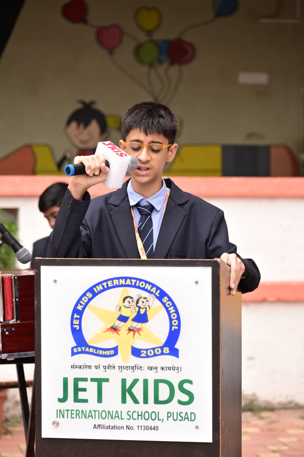 Young primary speaker at the podium