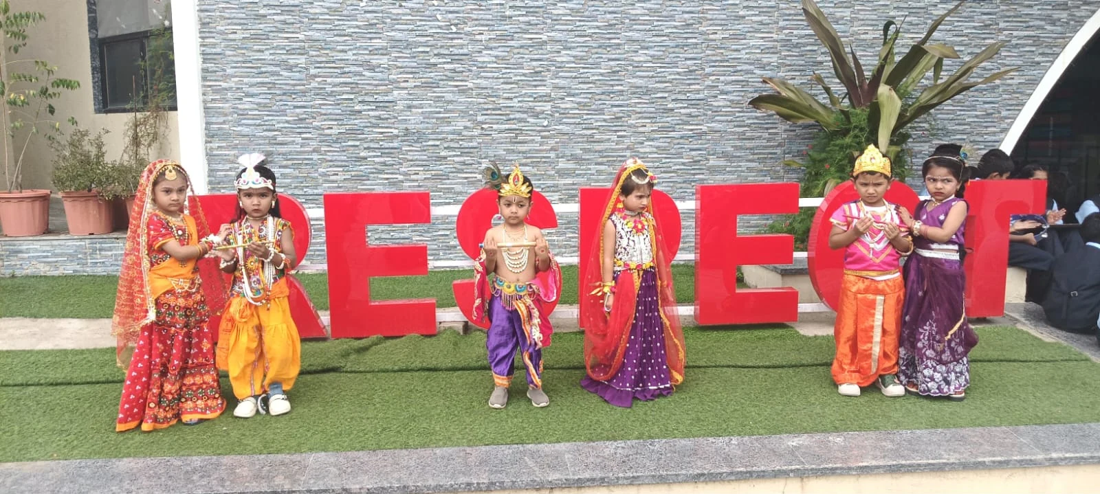 Young learners celebrating Janmashtami in traditional attire